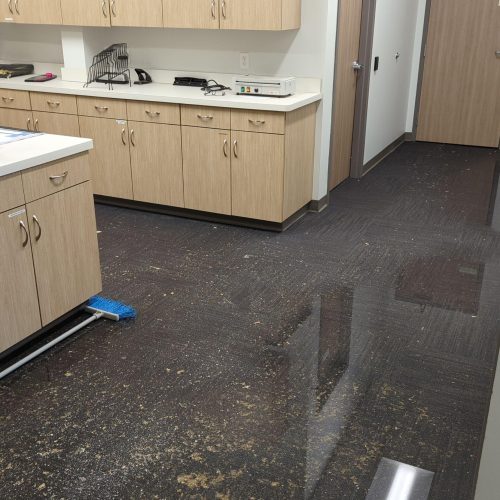 Standing water covering the floor of a commercial workroom